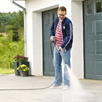 A man cleaning floors outside the house