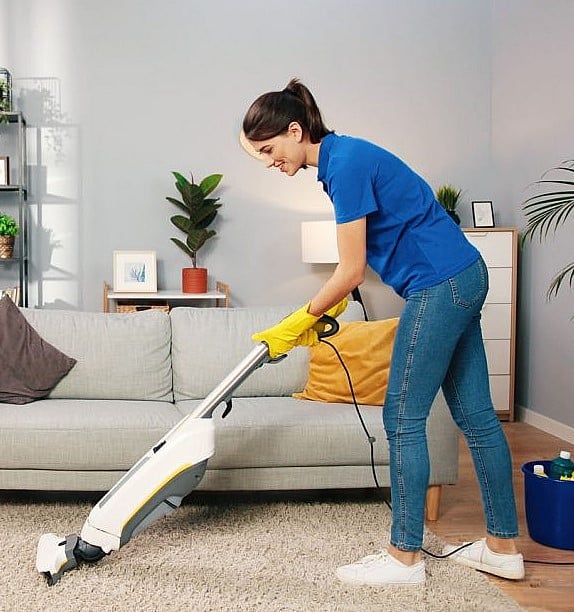 Maid cleaning carpets